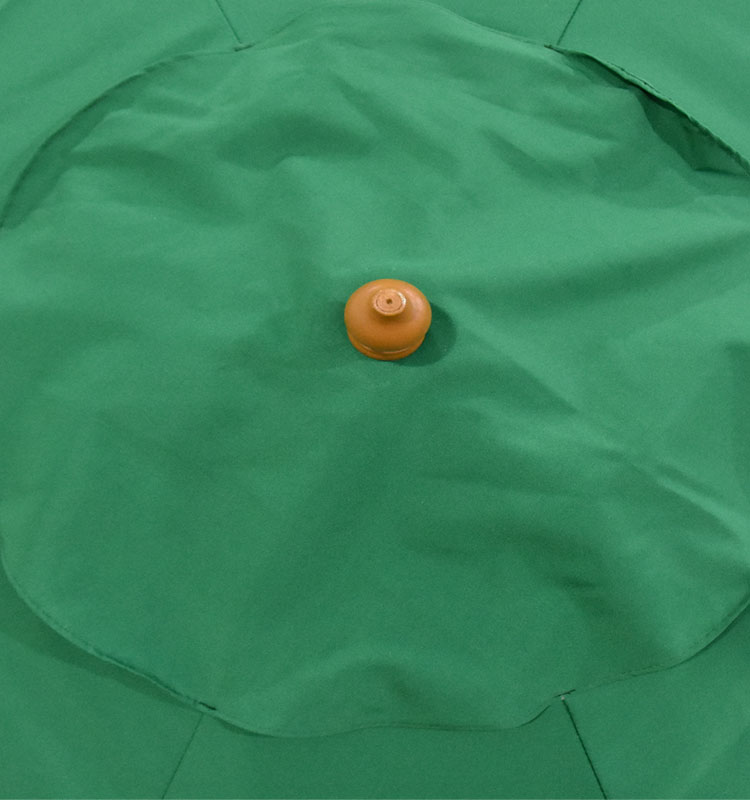 Large wooden garden umbrellas shaft up